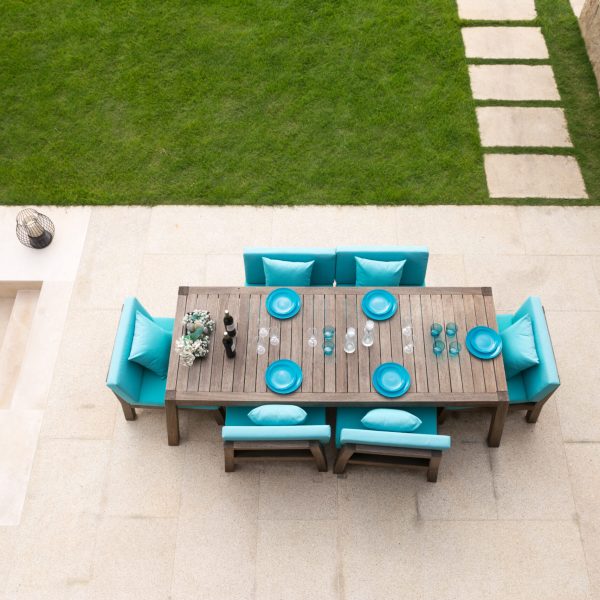 elegant table and chairs on empty ground near meadow on top view